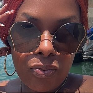 Miu Miu Round Sunglasses with Gold Accents